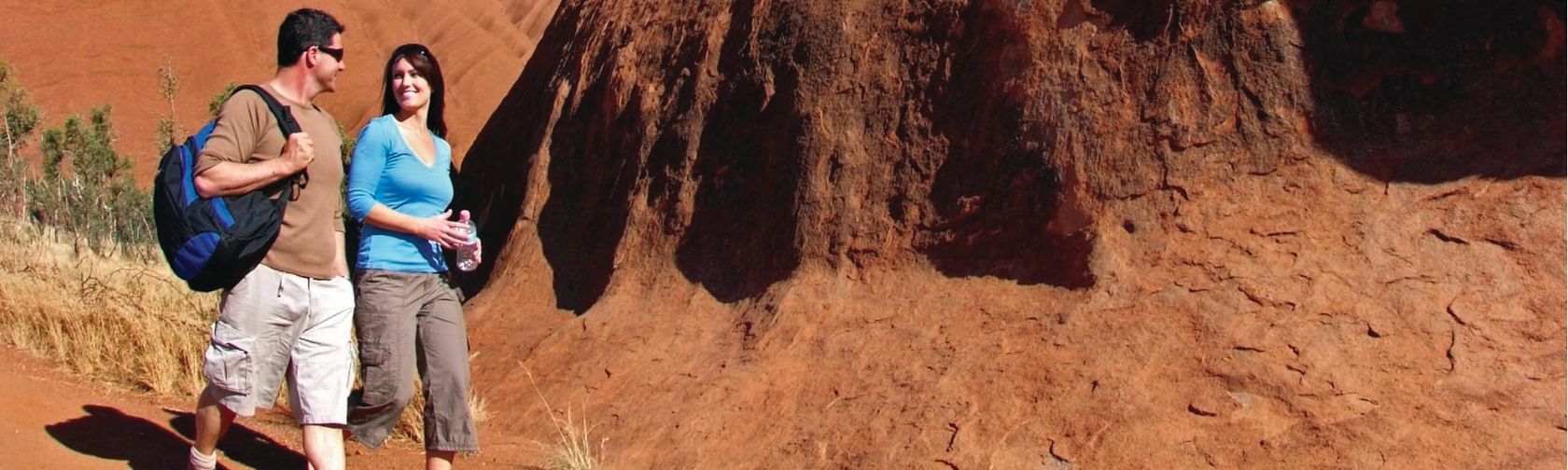 Walkers at Uluru. Photo: Tourism Australia