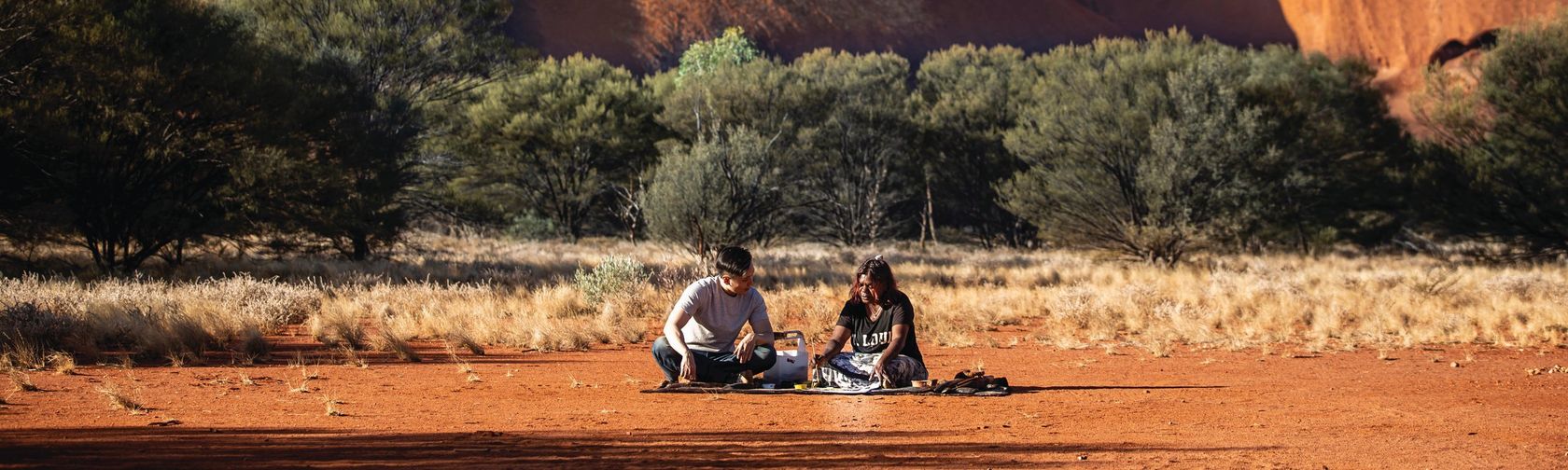 Dot painting with Maruku Arts. Photo: Tourism Australia