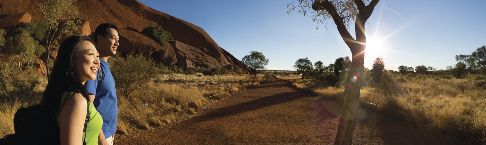 Exploring the base of Uluru on the Mala walk. Photo: Peter Eve and Tourism NT