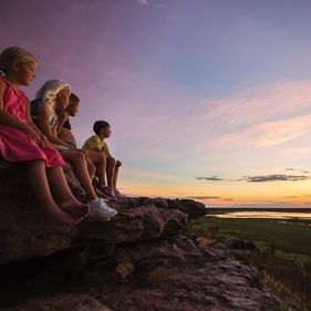 Children watch the sunset at Ubirr