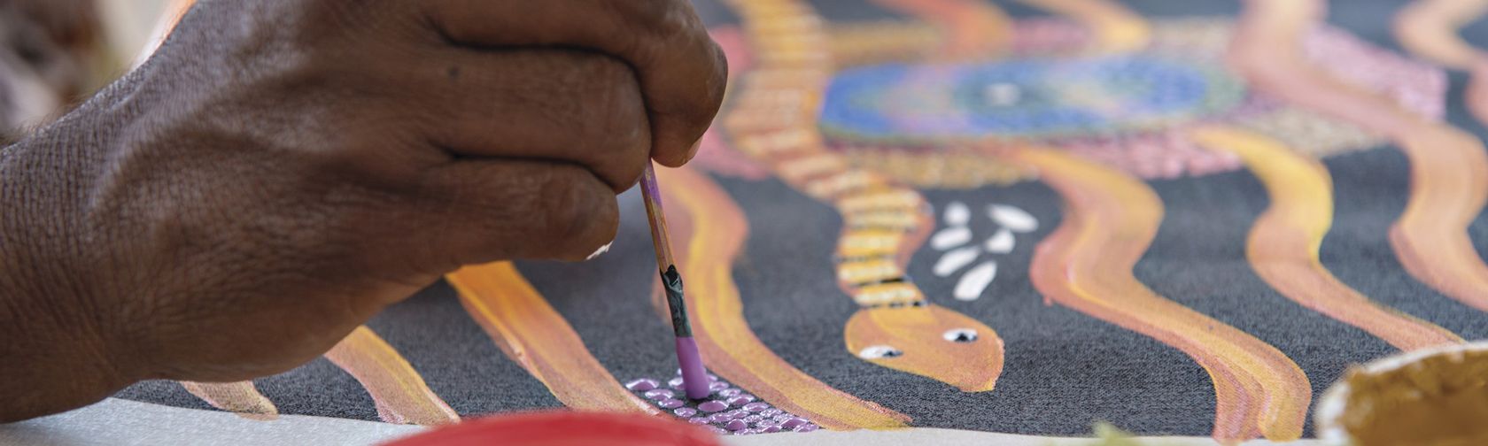 Dot painting with Maruku Arts. Photo: Tourism NT