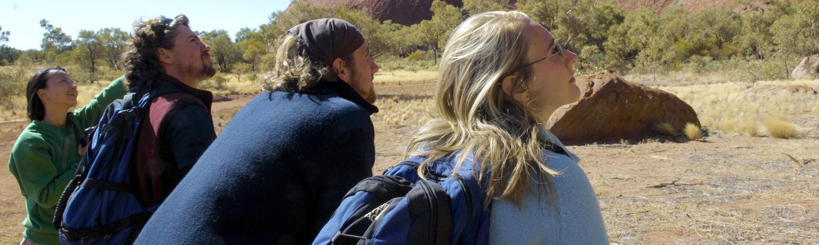 Taking a break on the Uluru base walk. Photo: Tourism NT